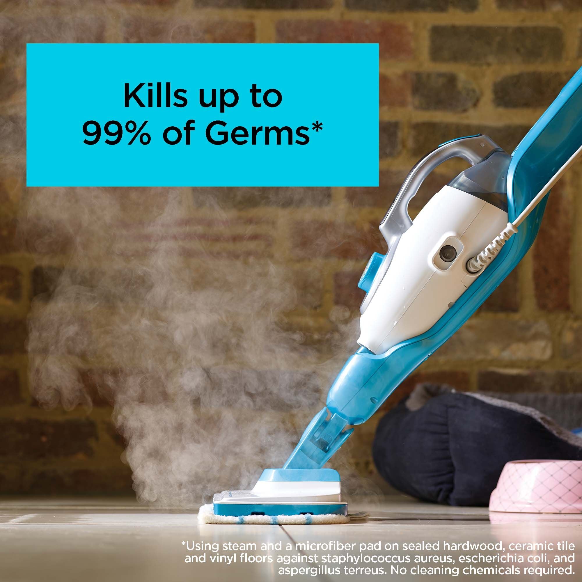 Talent using the BLACK + DECKER™ steam mop to clean a ceramic tile floor, which kills up to 99% of germs