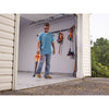 A man is cleaning his garage using a BLACK+DECKER 20V MAX* Cordless Sweeper with POWERBOOST™.