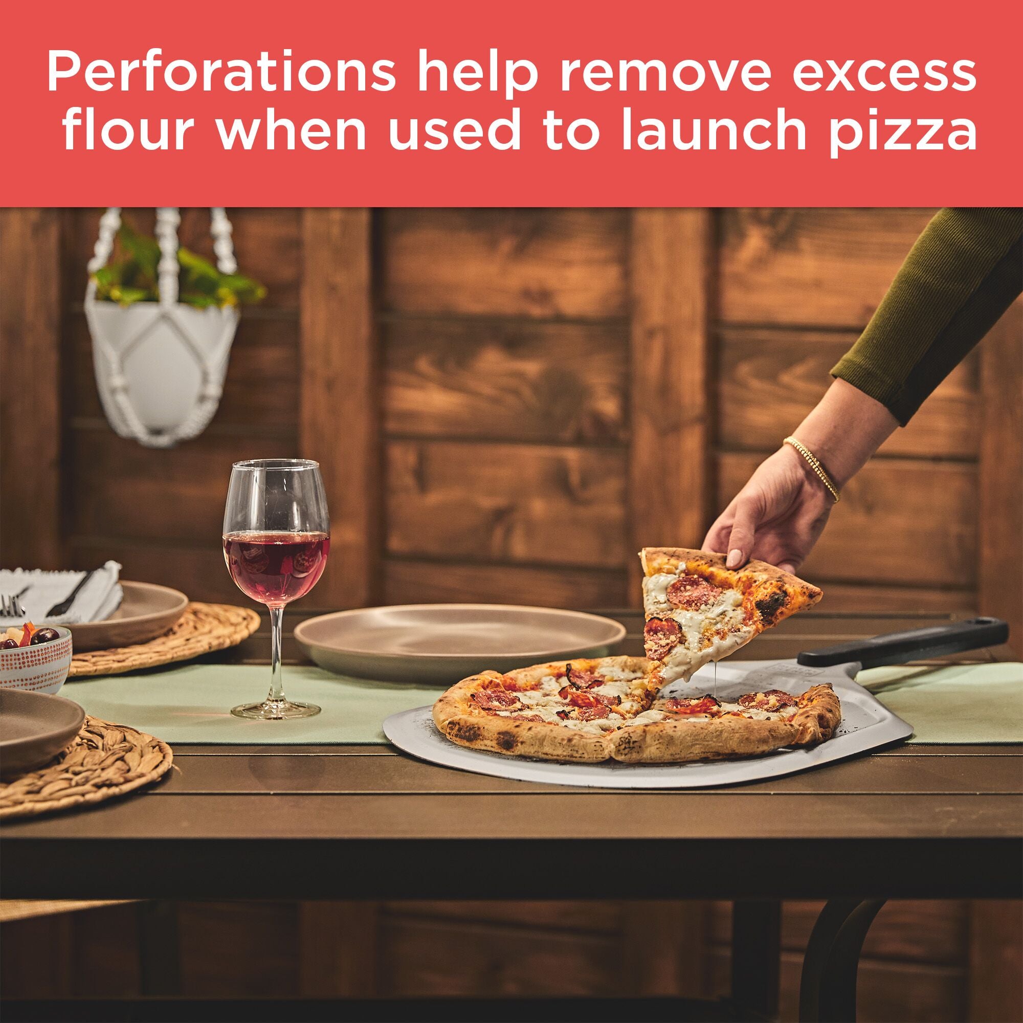 Perforations help remove excess flour when used to launch