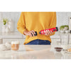 Talent showing how to attach the BLACK+DECKER kitchen wand milk frother attachment to the red power unit