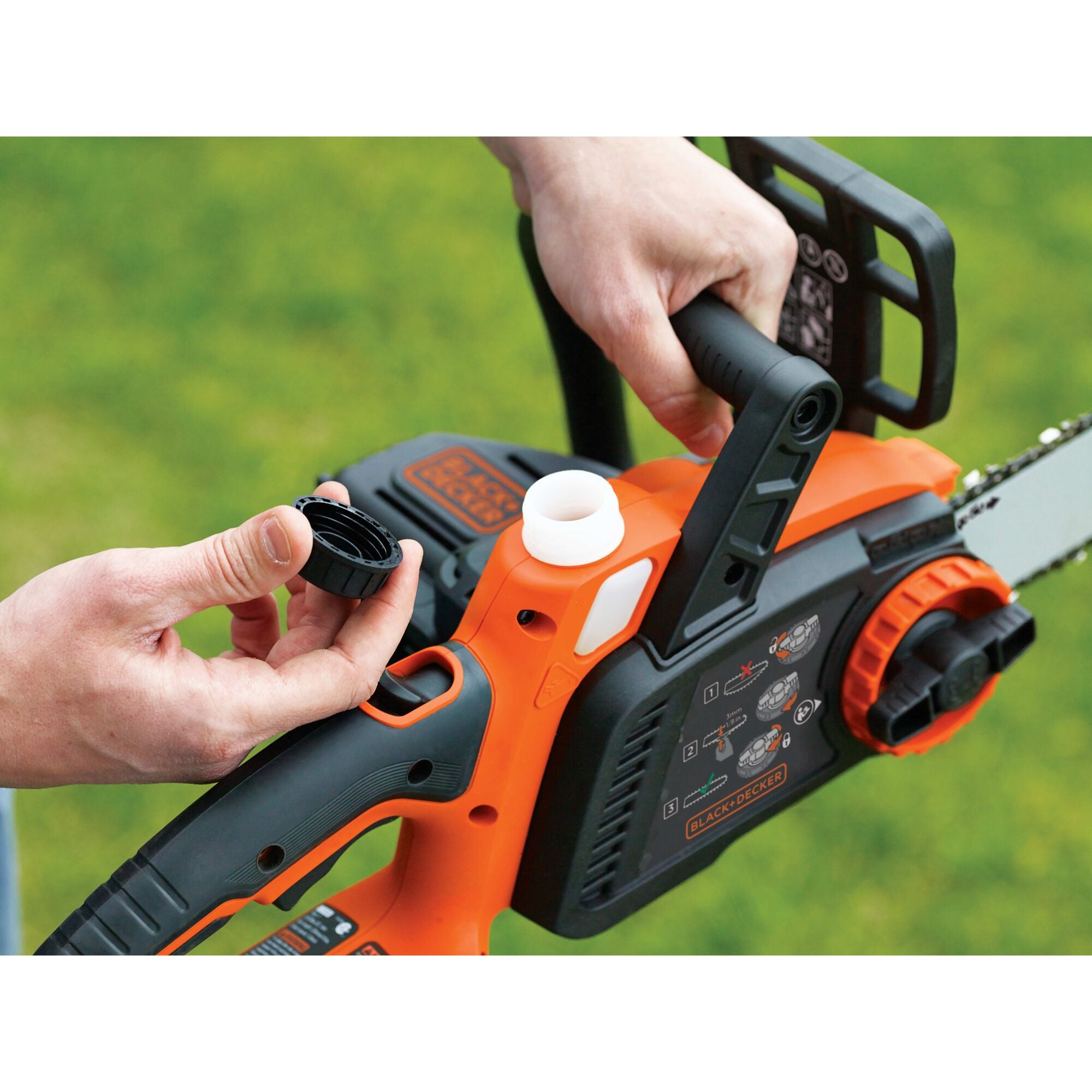 A person cuts a log with the BLACK+DECKER 40V MAX* 12-in. Cordless Chainsaw. Wraparound handle keeps you in control of every cut.