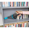 BLACK+DECKER dustbuster® Classic Cordless Hand Vacuum cleaning dust off book shelf