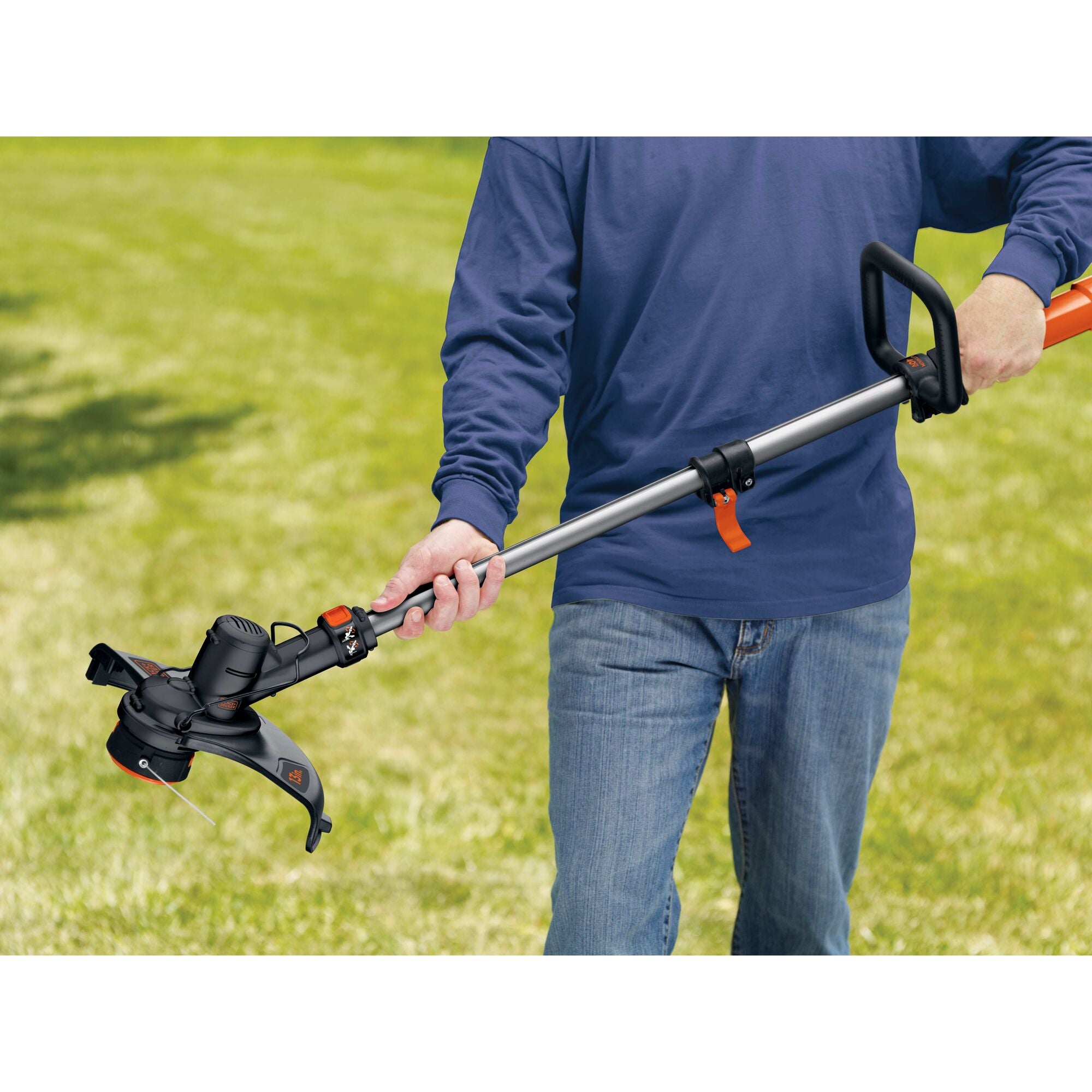 A person trims the edge of the yard with the BLACK+DECKER 40V MAX* 13-in. 2-in-1 Cordless String Trimmer/Edger with POWERCOMMAND™ Kit. AFS Automatic Feed Spool® effortlessly feeds trimmer line - no bumping required.