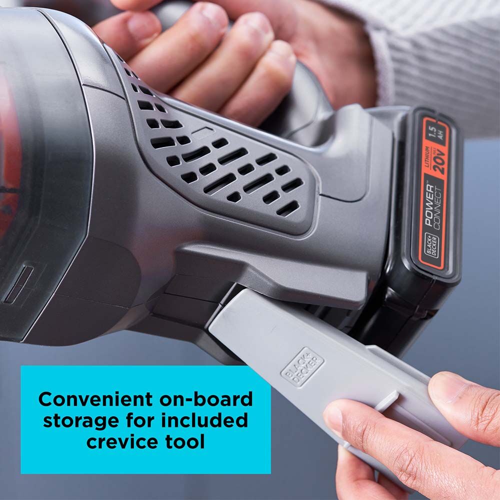 Person using crevice tool for the BLACK+DECKER dustbuster 20V MAX* Hand Vac