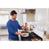 Talent using the red, BLACK+DECKER kitchen wand immersion blender to blend soup