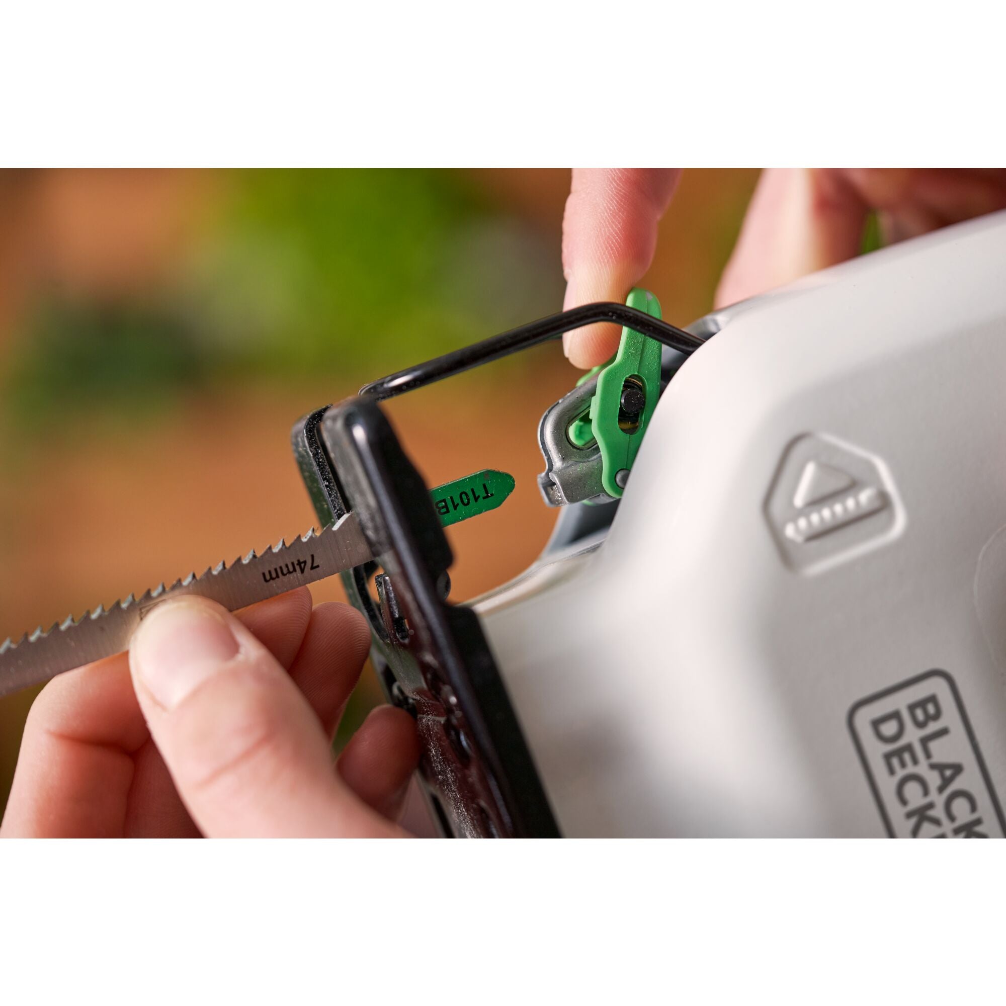 BLACK+DECKER reviva™ 12V MAX* Jigsaw cutting wood panels.