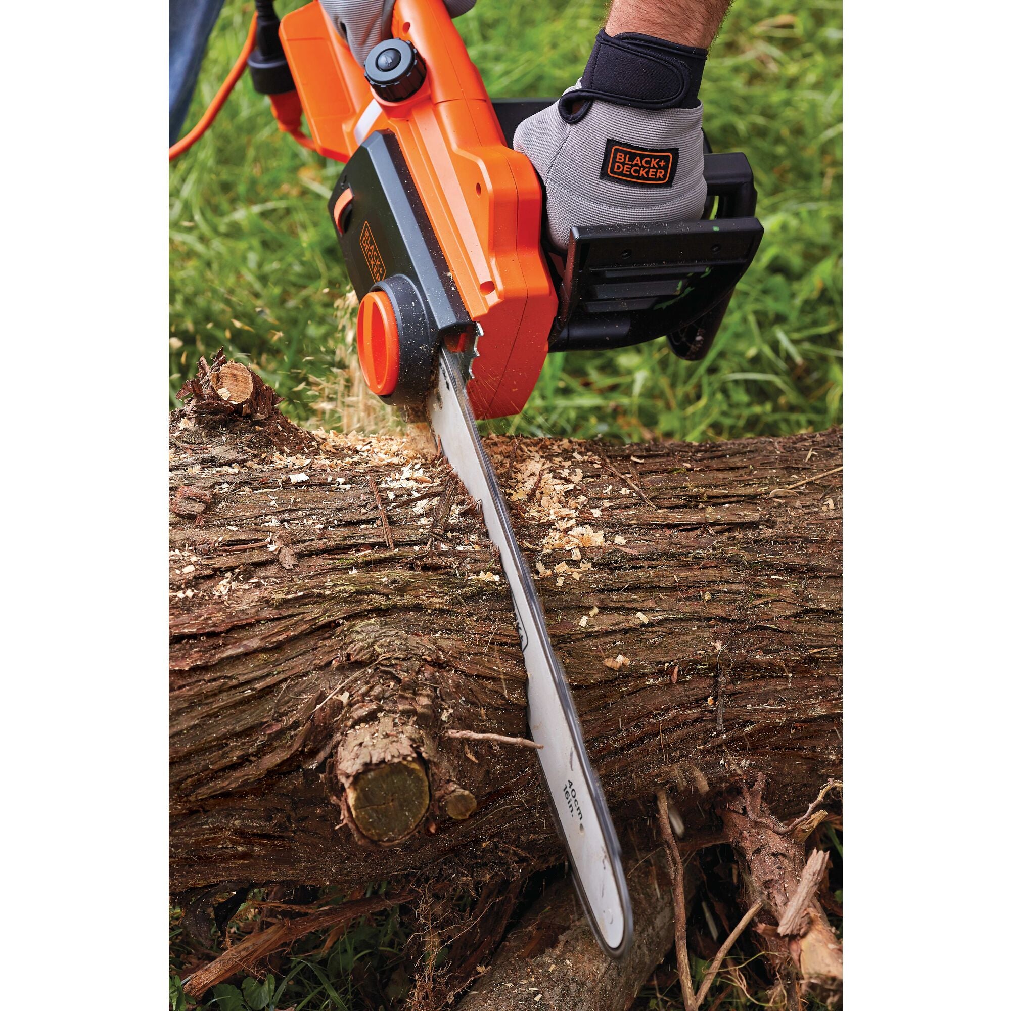 BLACK+DECKER Electric Chainsaw is cutting a huge tree trunk.