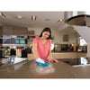 8 in 1 complete steam cleaning system being used by a person to clean the table top.