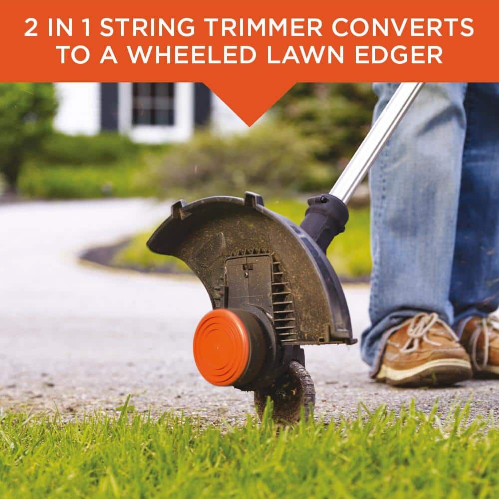 Lithium 12 inch 2 speed string trimmer / edger being used by a person to trim grass.
