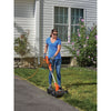 12 inch 3 in 1 Compact Electric Lawn Mower being used by person to mow lawn outdoors.