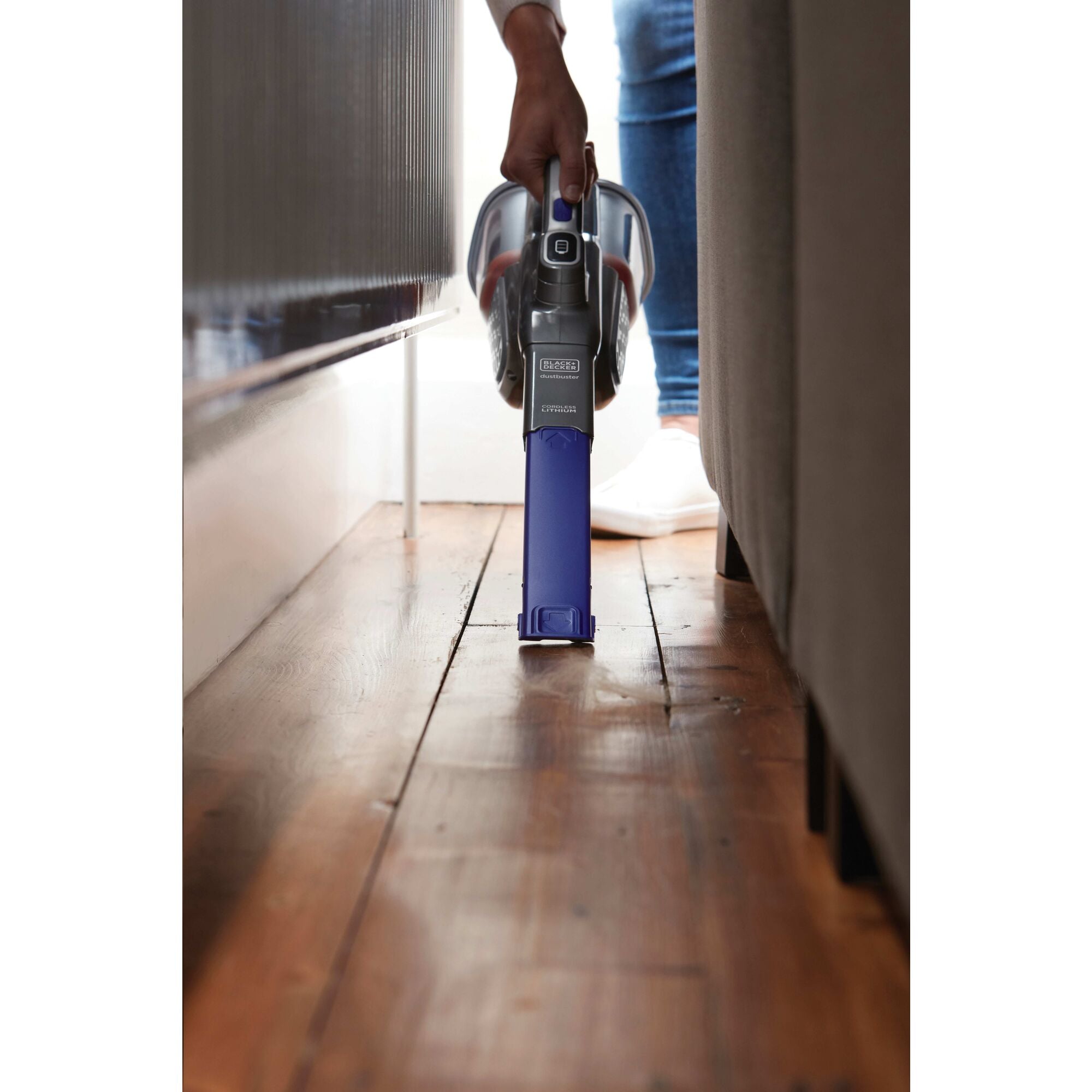 Dustbuster Advanced Clean plus Pet Cordless Hand Vacuum being used by person to clean the nooks and corners of car seat.