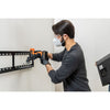 Person uses the BLACK+DECKER Multi-tool attachment to cut a hole in drywall.