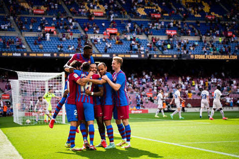 FC Barcelona team celebrating a goal on the field
