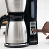 Digital controls of 12 Cup Thermal Programmable Coffeemaker in use.