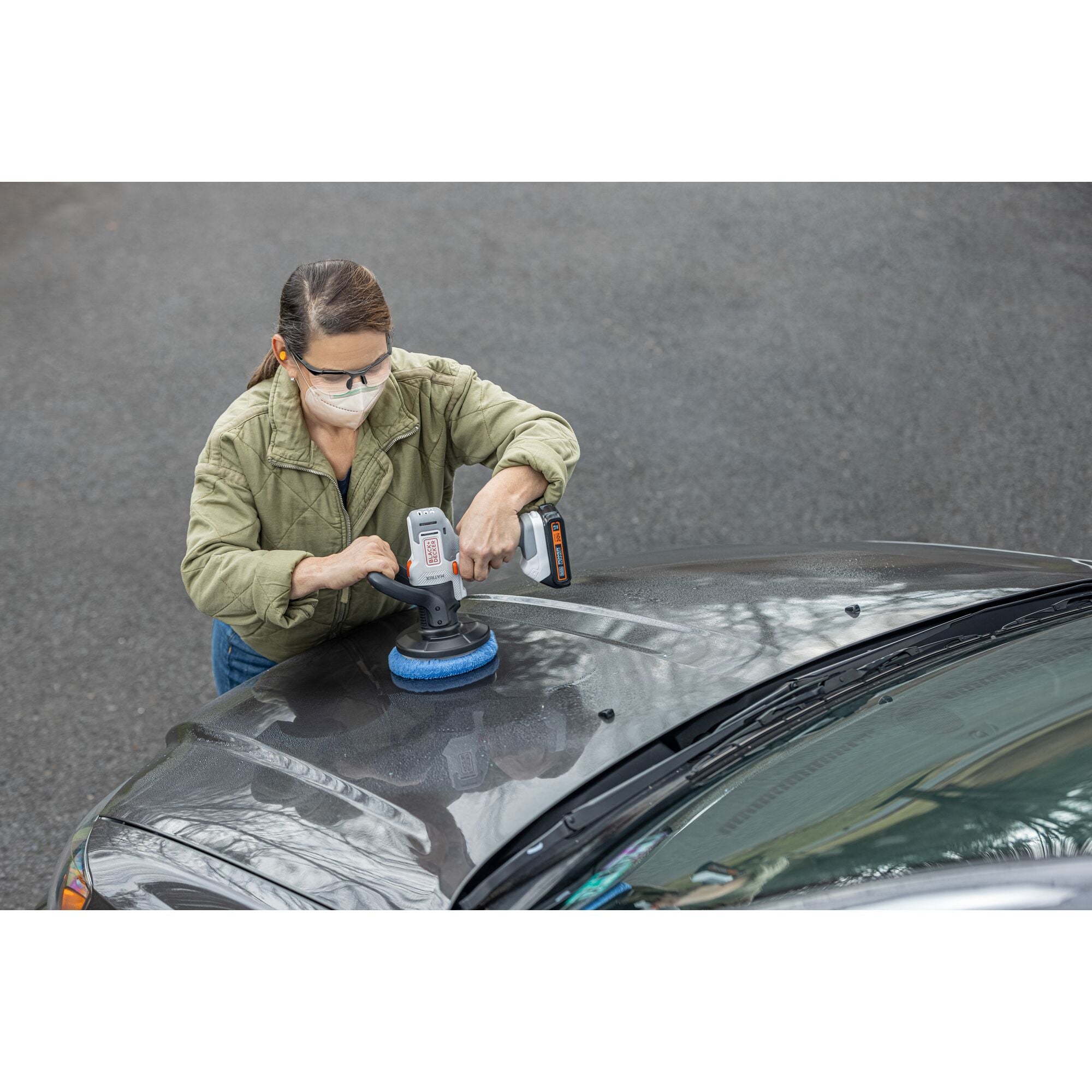 Person uses the BLACK+DECKER MATRIX buffer attachment to polish a car hood.