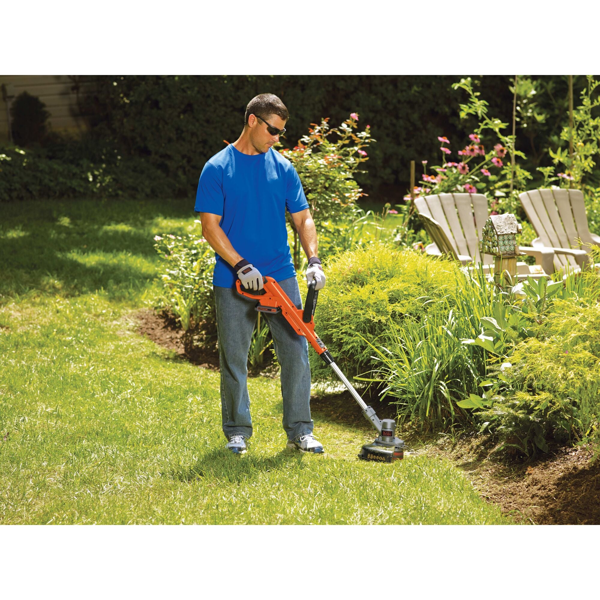 Man using 20V Max Lithium String Trimmer 12In around a garden bed.