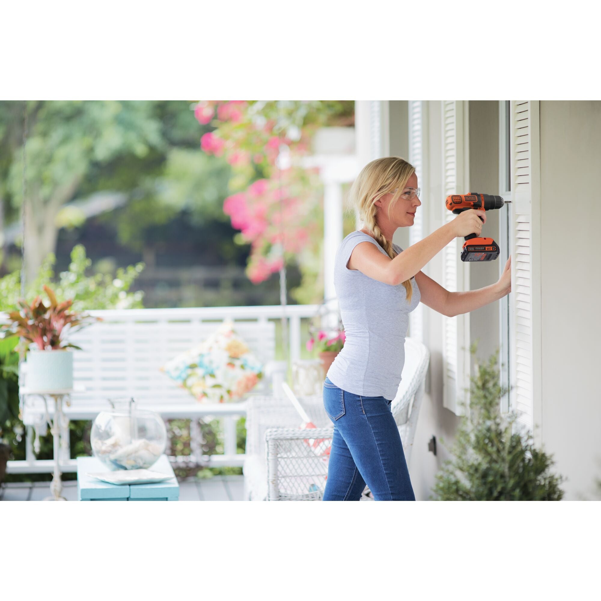 20 volt MAX cordless lithium drill driver being used by a person to drill a hole in window frame.