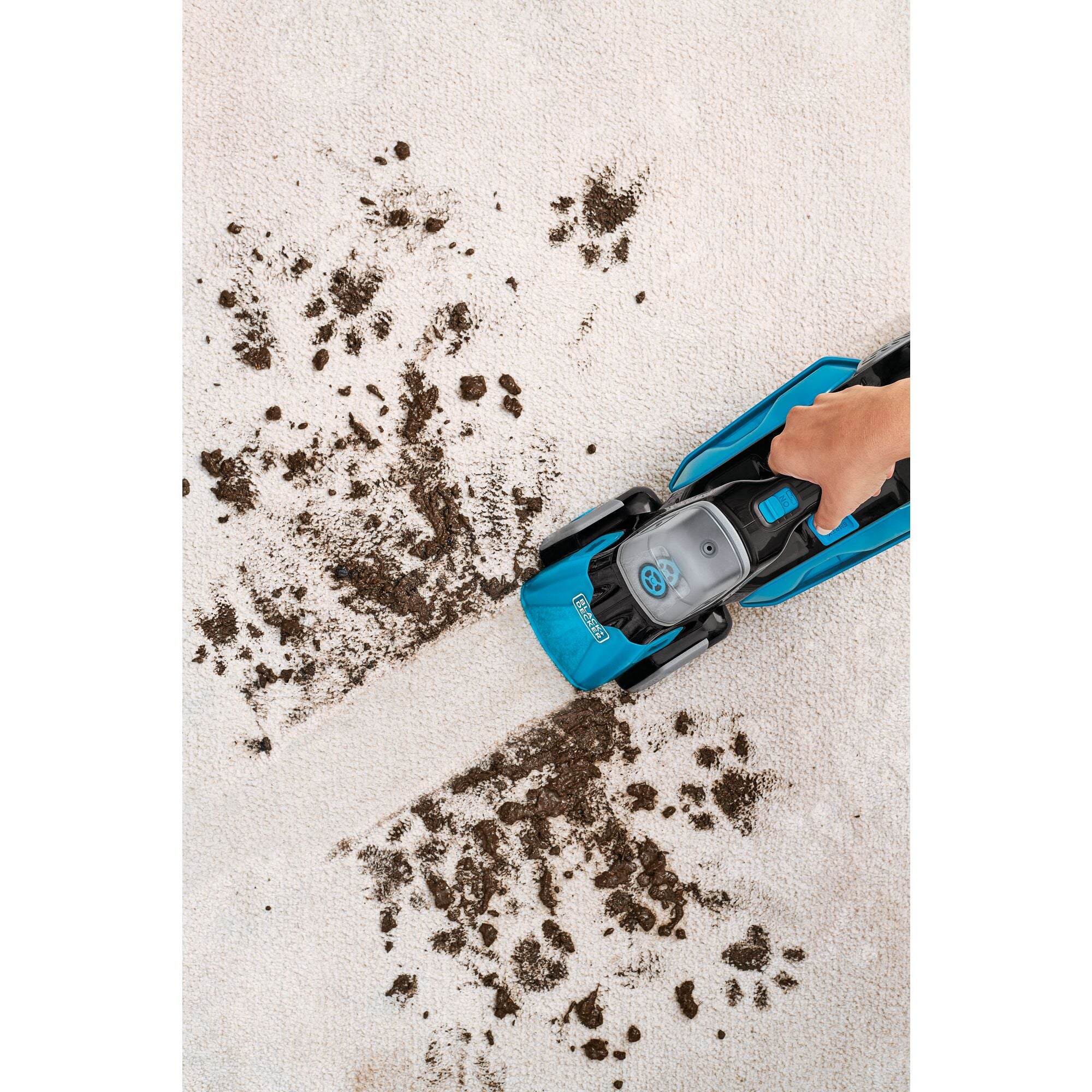 spill buster Cordless Spill plus Spot Cleaner with Powered Scrub Brush being used to clean mud off of carpet.