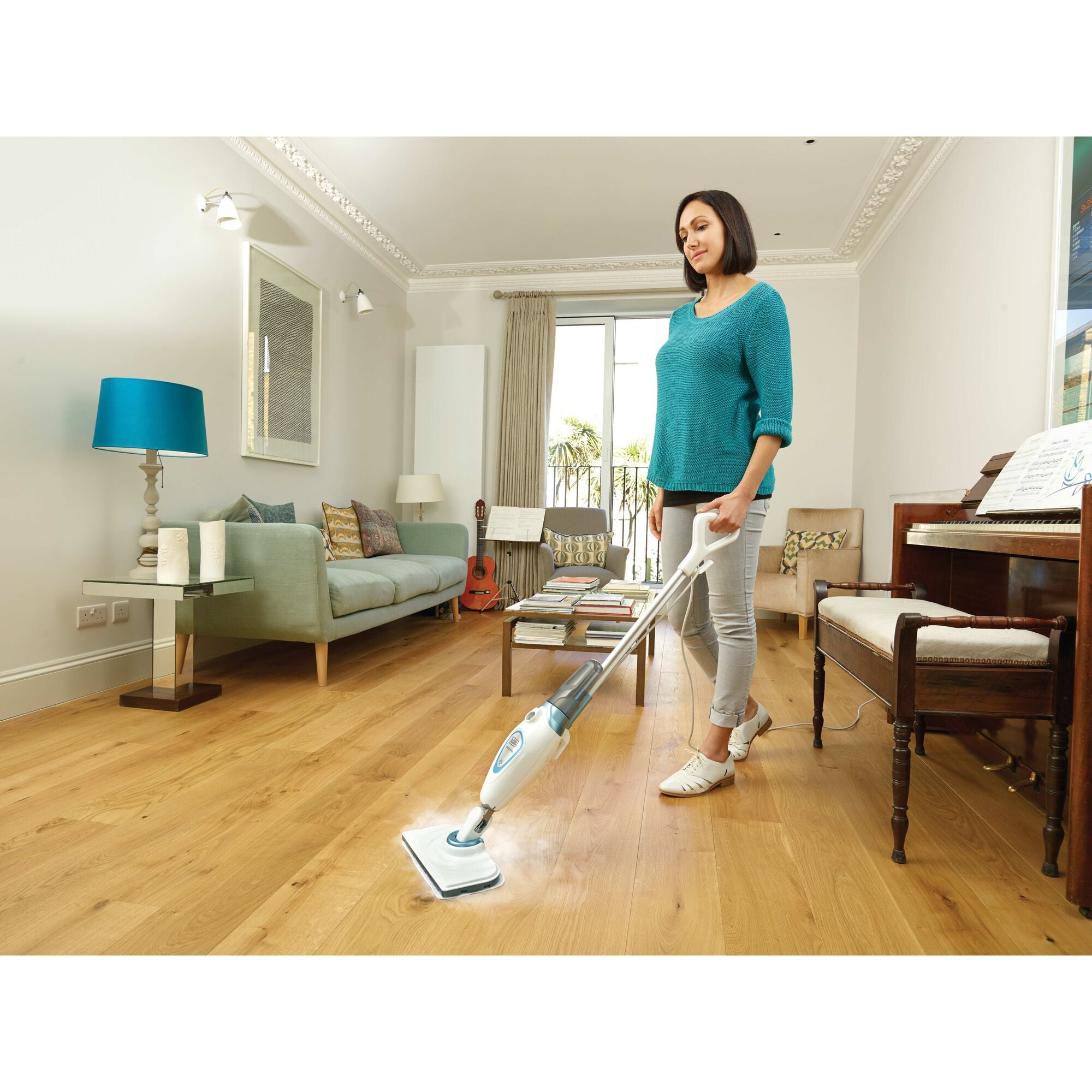 Steam Mop with Lift plus Reach Head being used to clean room floor.