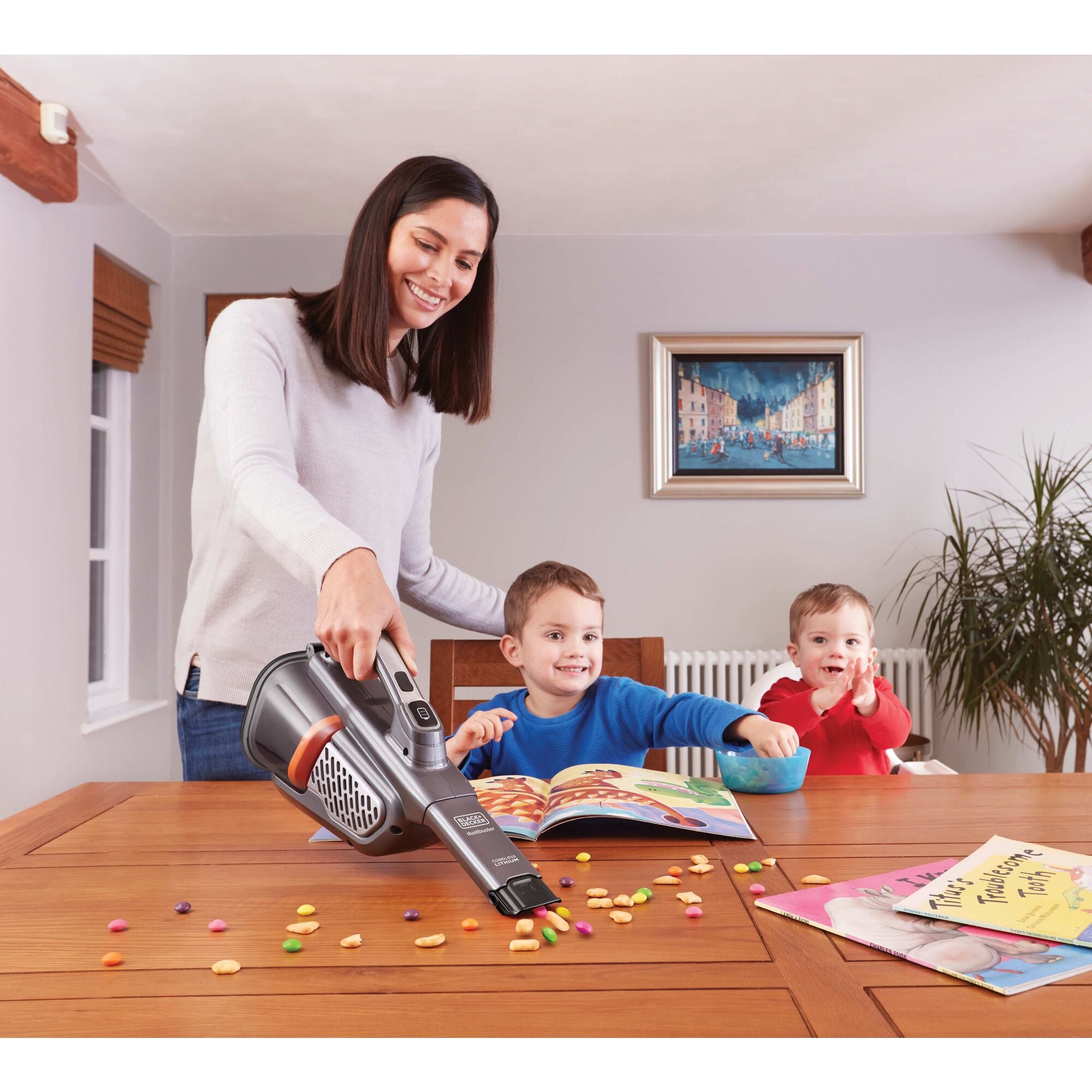 A person cleans a surface with the BLACK+DECKER dustbuster® 16V MAX* AdvancedClean+™ Hand Vacuum.125% longer runtime than our leading hand vacuum.*