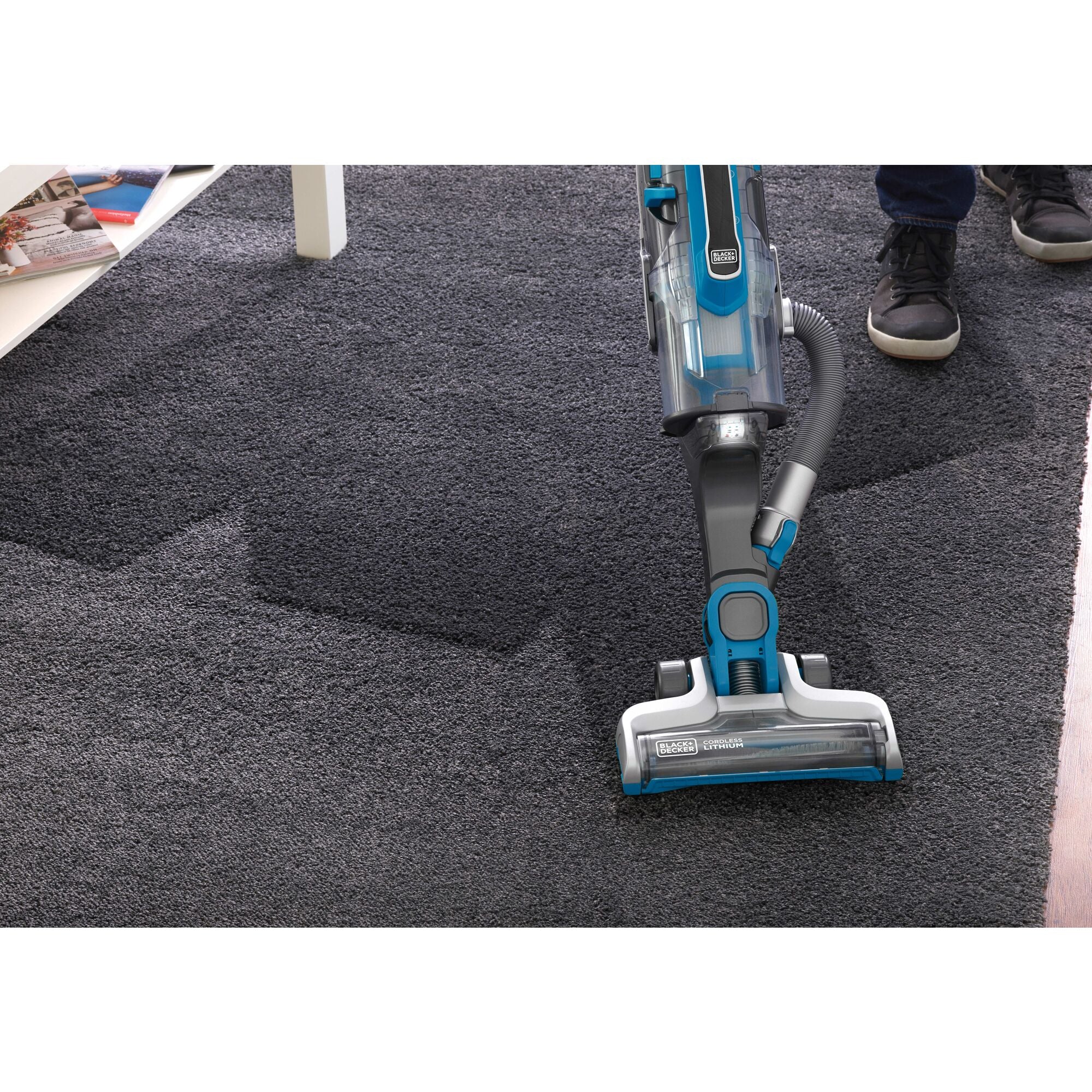 POWER SERIES PRO Cordless 2 in 1  Vacuum being used to clean rug.