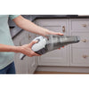 Dustbuster quickclean cordless hand vacuum being set up for use.