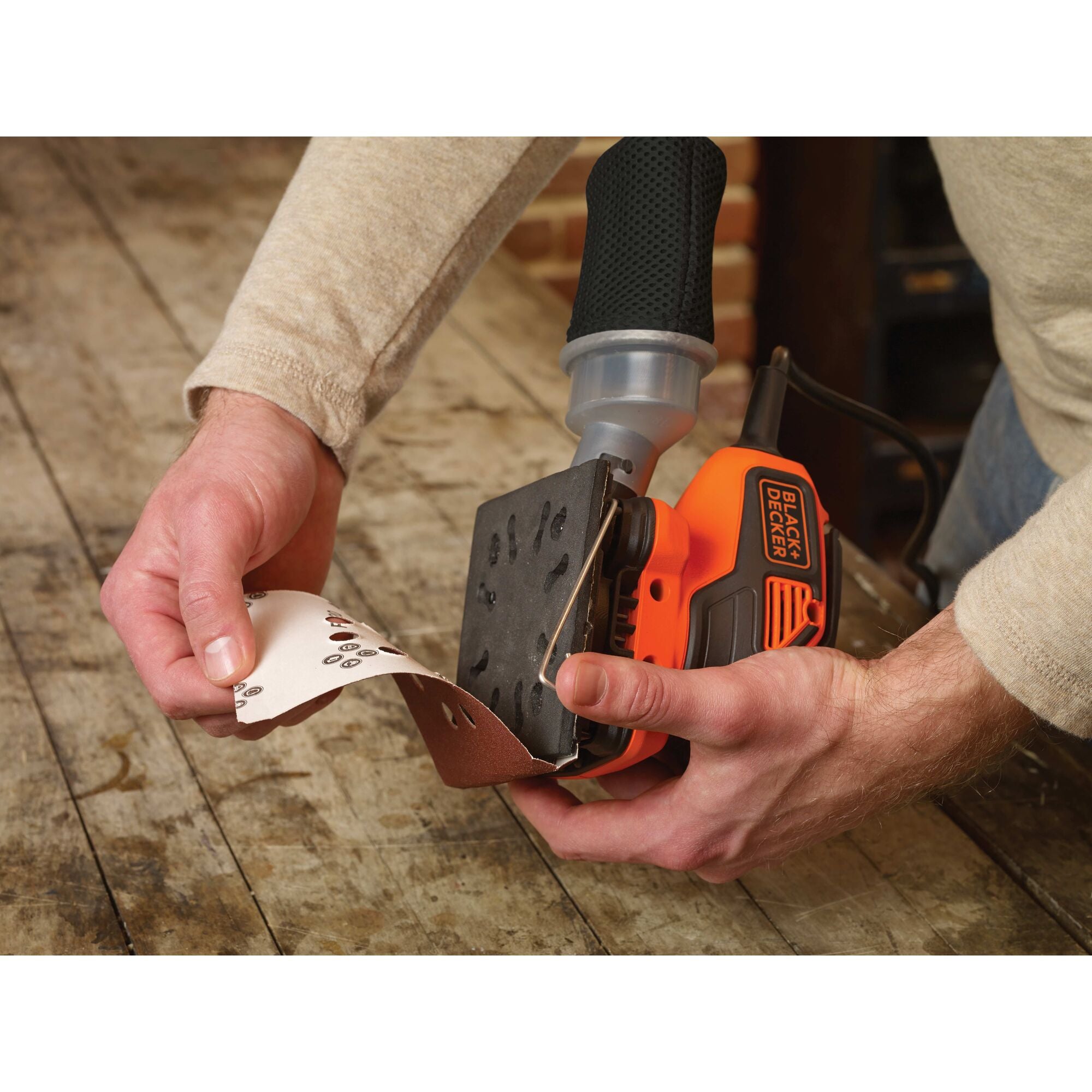 Paddle switch feature of one quarter sheet orbital sander with paddle switch actuation.