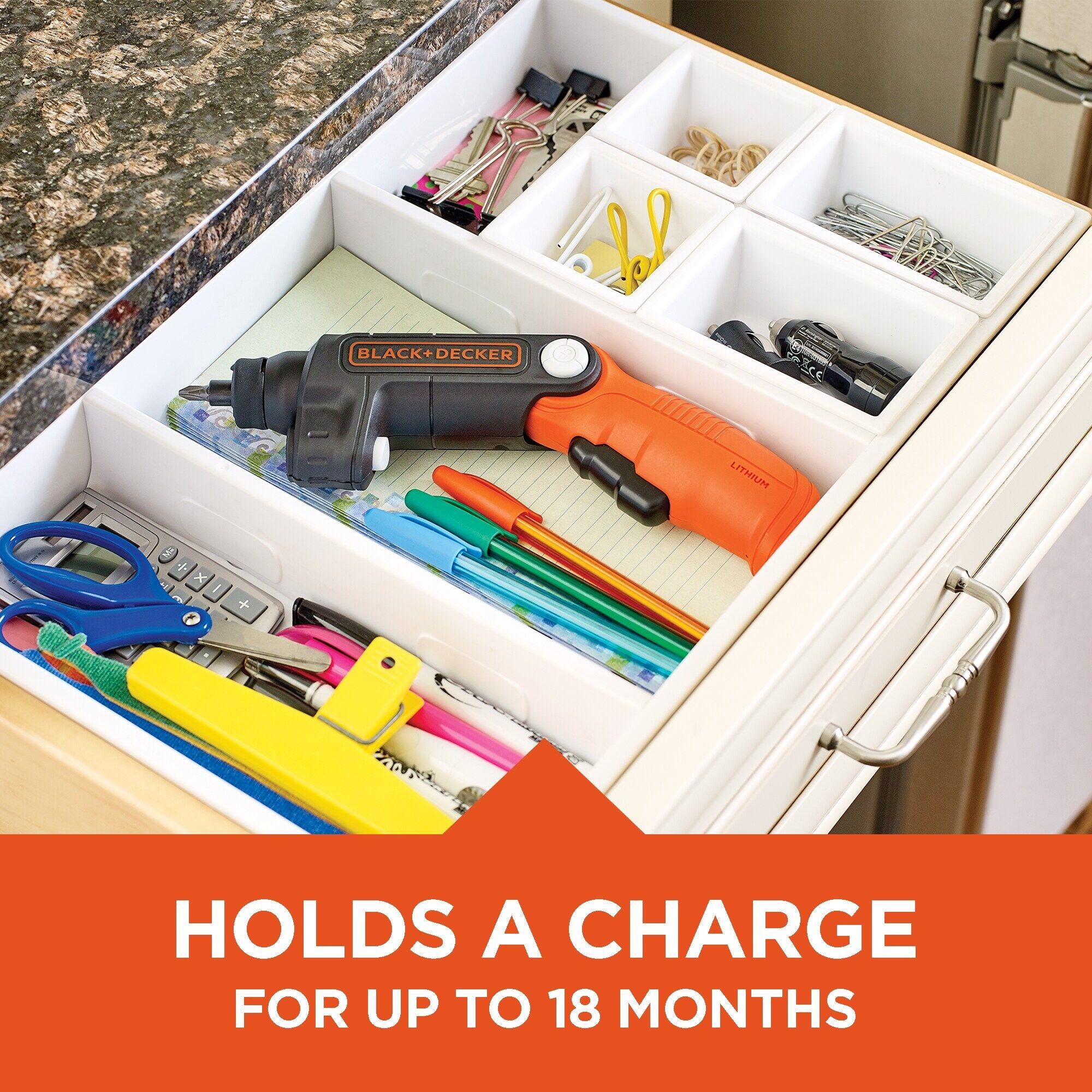 Black and decker 4 volt MAX lithium ion light driver cordless screwdriver sitting in a drawer organizer