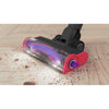 The floorhead in action on a hardwood floor using its LED headlights - BLACK+DECKER SUMMITSERIES select cordless stick vacuum.