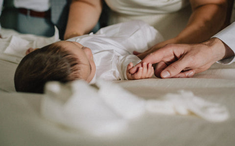 a baby sleep on bed