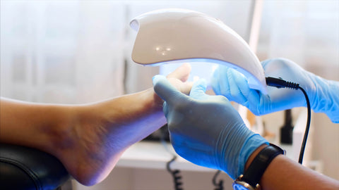 Shellac pedicure being cured with a UV Lamp