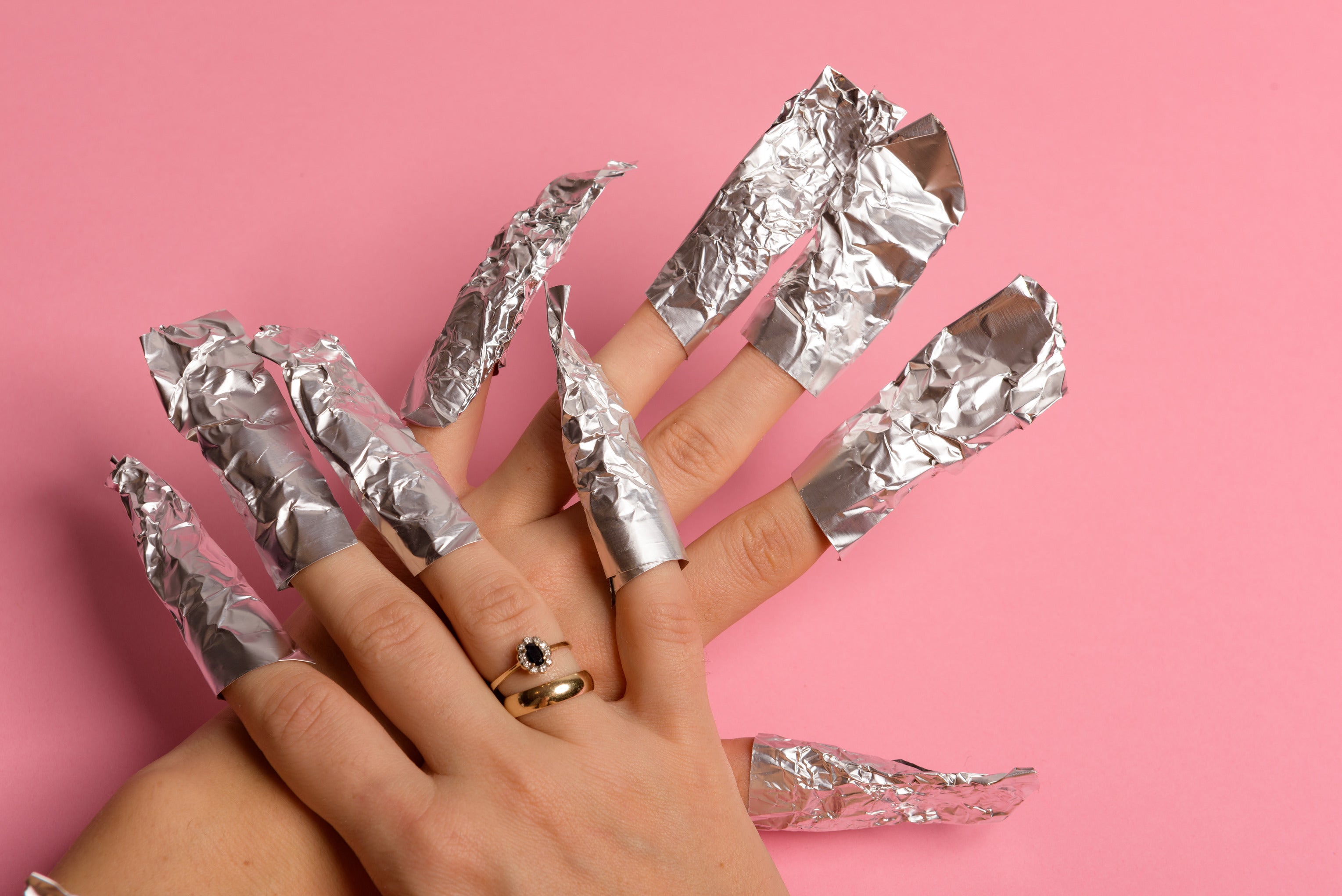 Nail soaked in acetone covered by aluminium foil