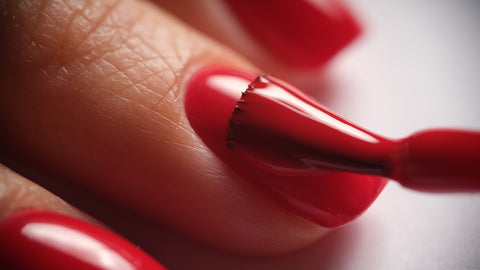 Red Gel Polish being applied to a nail