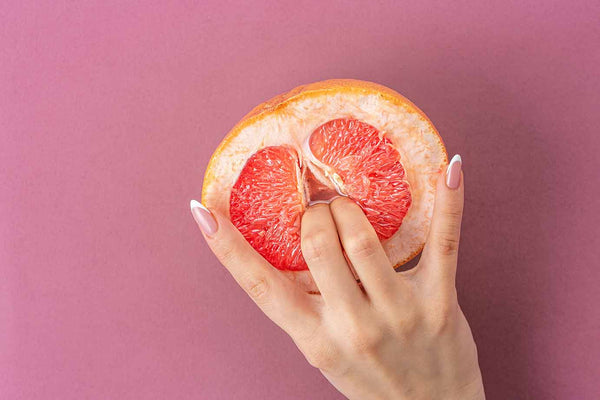fingers in grapefruit