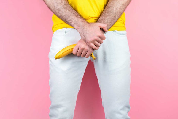 man holding a banana