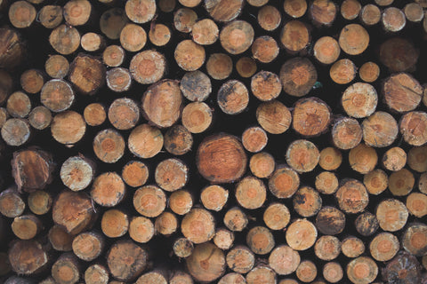 Full frontal picture of logs of lumber cut up and stacked