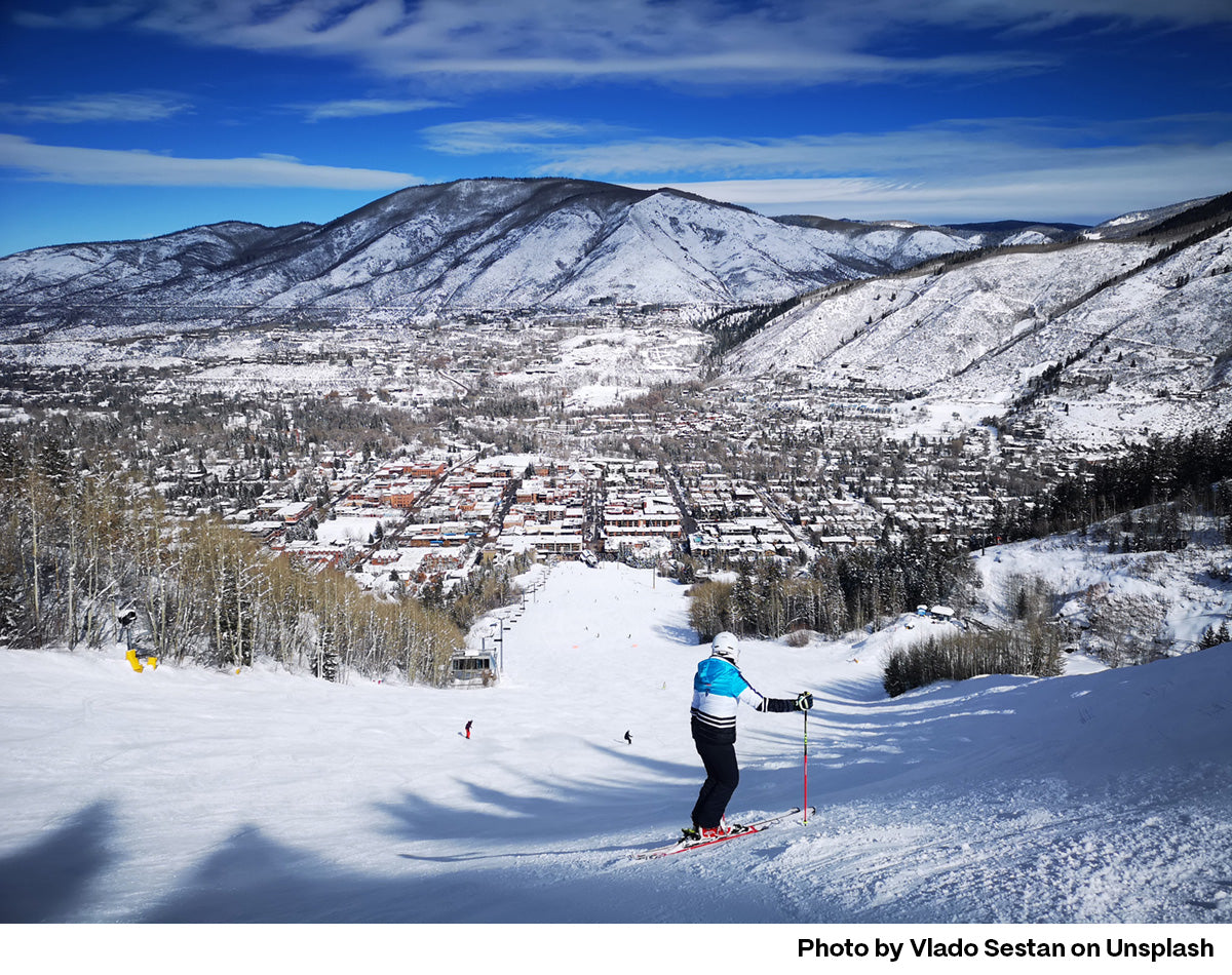 Female Skier heading down Aspen Mountain