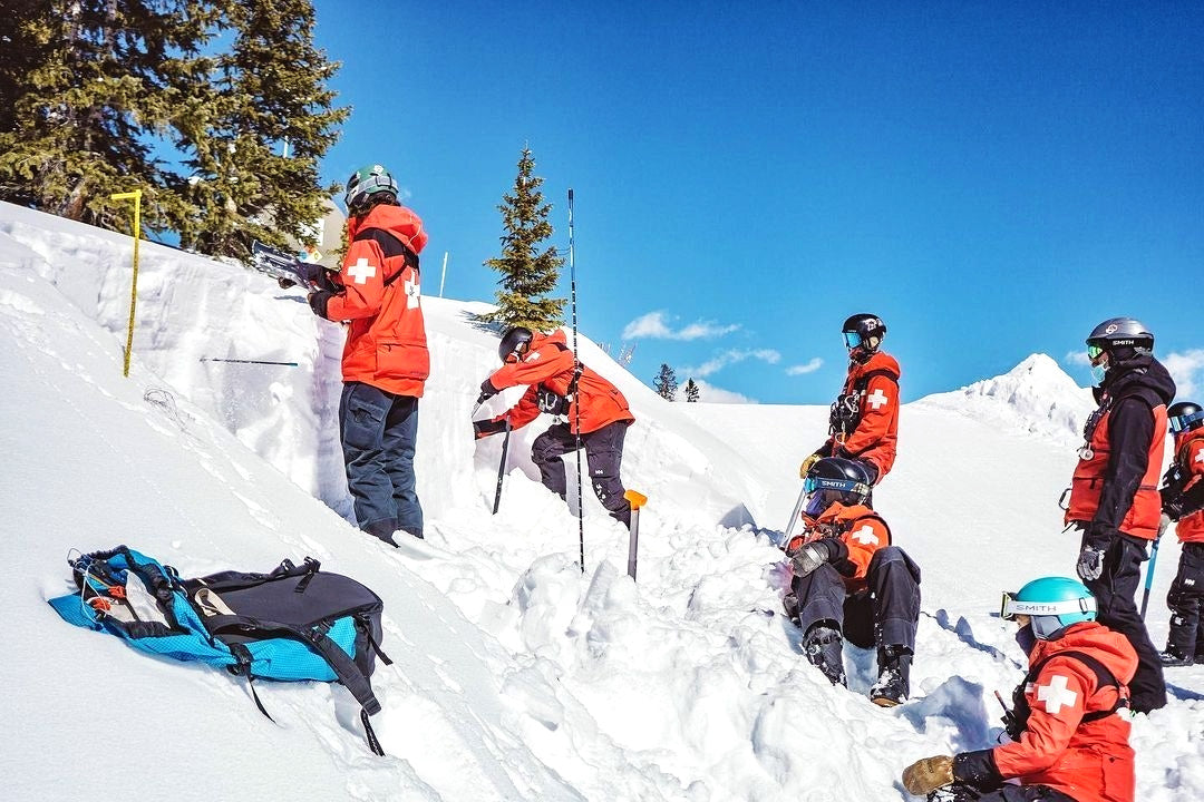 Ski patrol checking avalanche conditions