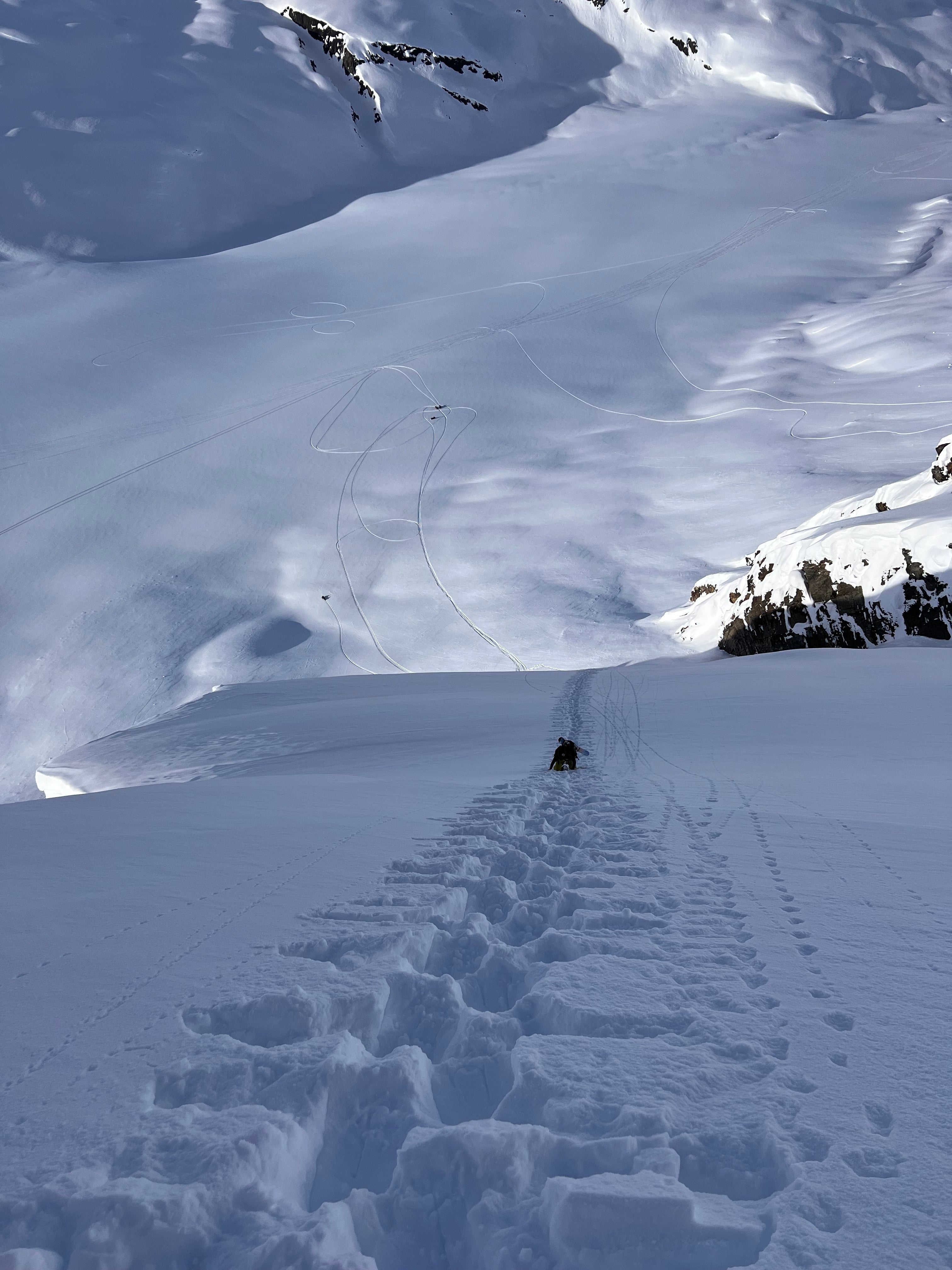 Anna Tedesco hiking a mountain to ski in Alaska