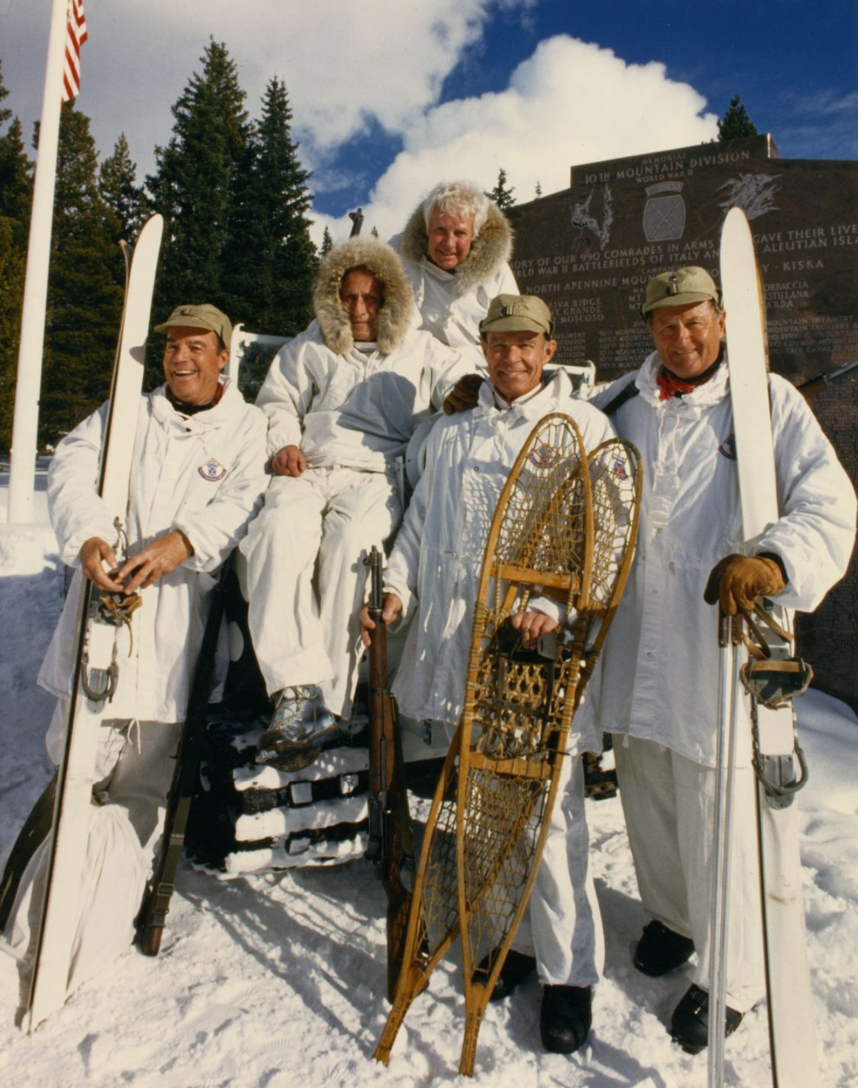 Five 10th Mountain Division veterans posing near the 10th Mountain Division Memorial