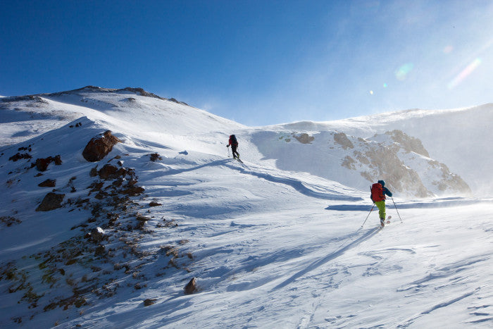 a couple hiking towards their 10th mountain division hut.