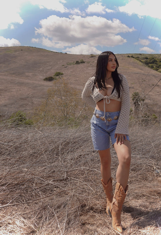 girl in denim shorts in desert