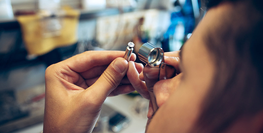 Jeweller polishing a custom diamond ring