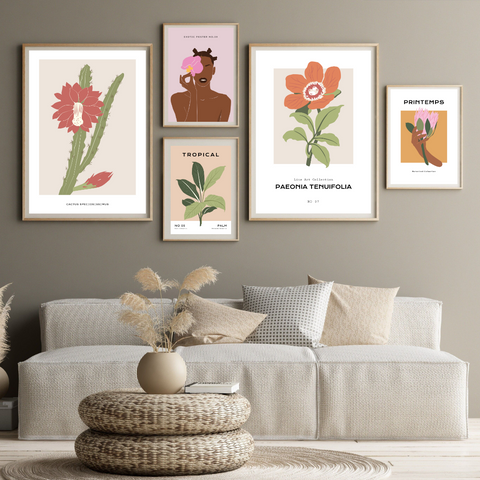 alt="five different floral prints with exotic and tropical flowers in a cozy living room"