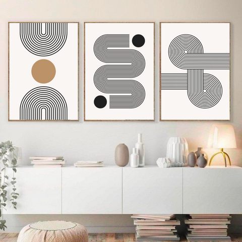 alt="three modern black and white art prints to add some personality to the living room"