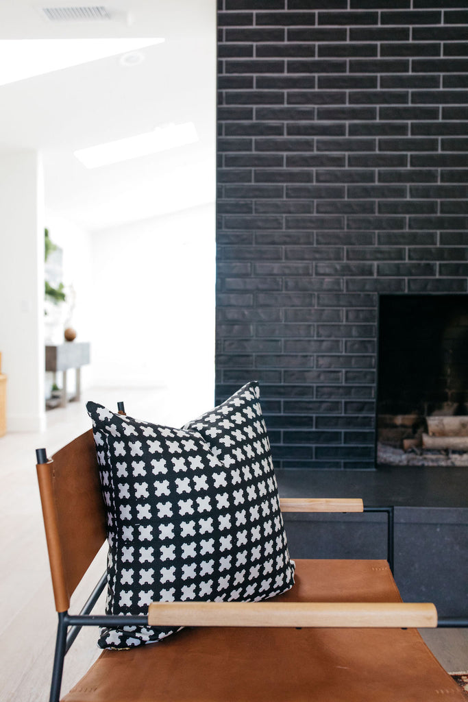 greige design shop + interiors alexandria project san diego california beach house black stacked tile fireplace living room design