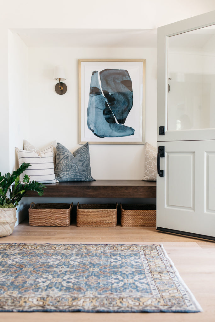 Bright white modern California Coastal retreat entryway bench by greige design shop + interiors in Laguna Beach, Ca.