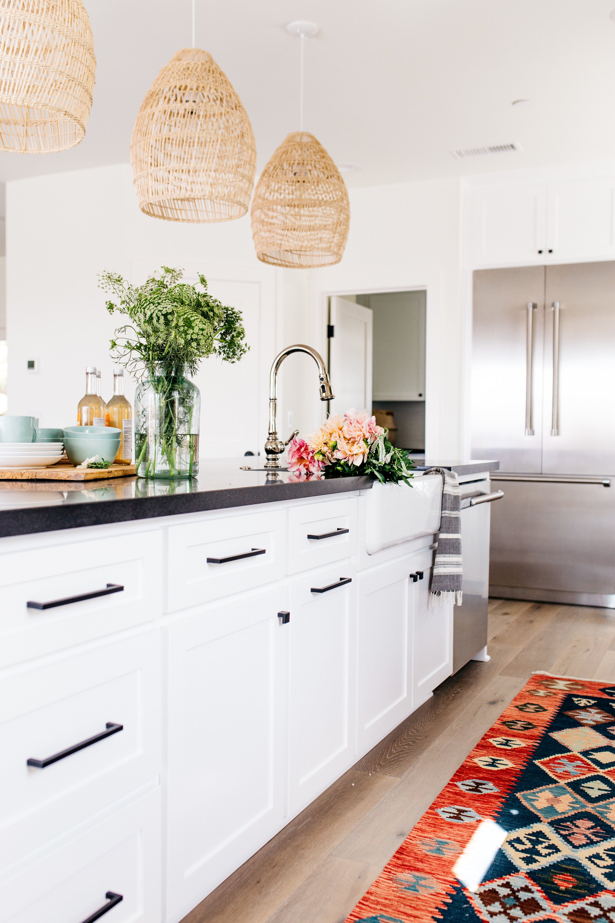 Devonshire greige design shop + interiors black and white kitchen woven pendants