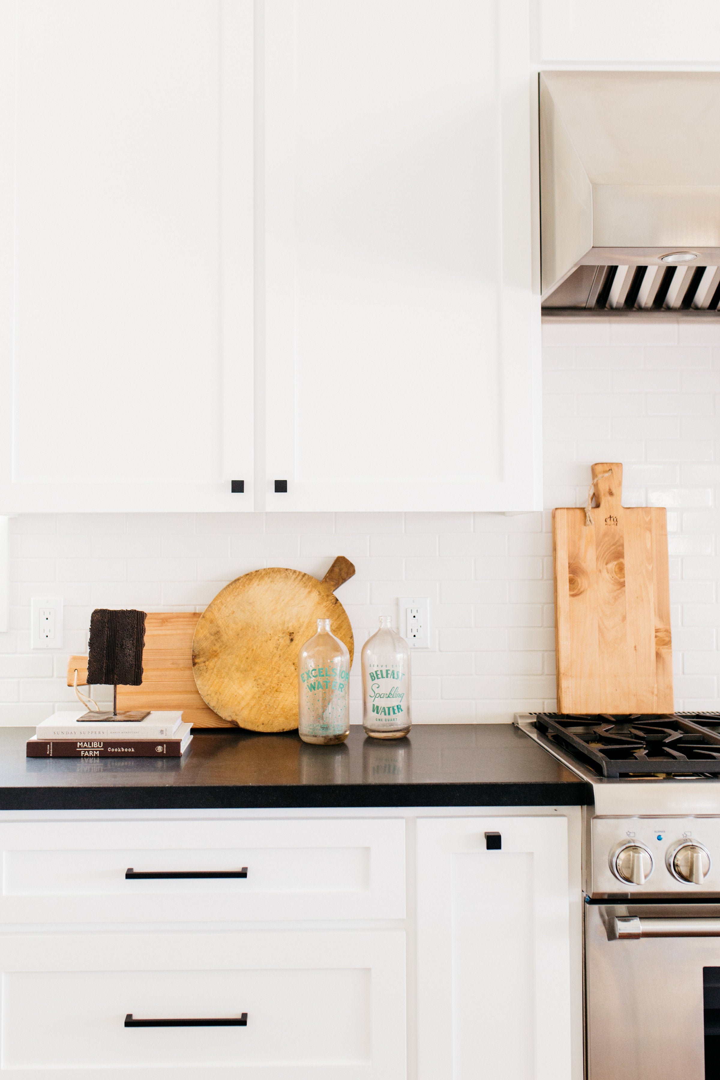 Devonshire greige design shop + interiors black and white kitchen woven pendants