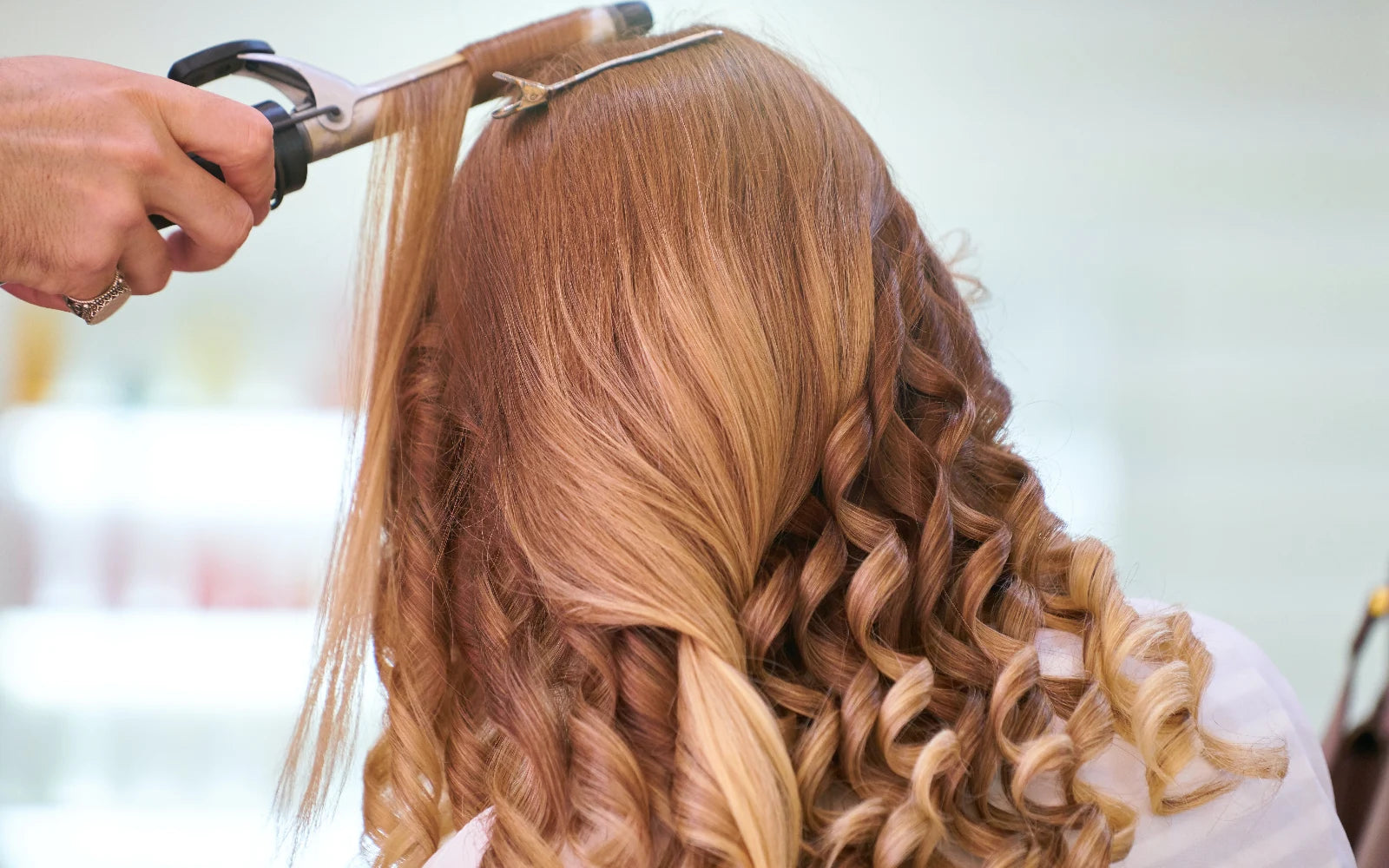 How to curl hair with a curling iron or a wand